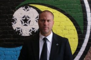 Gio Savarese posing at the Cosmos office