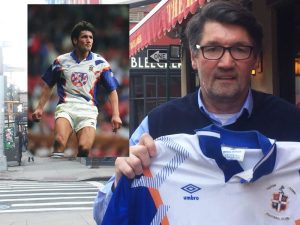 mick harford poses with a luton shirt outside red lion soccer bar in new york