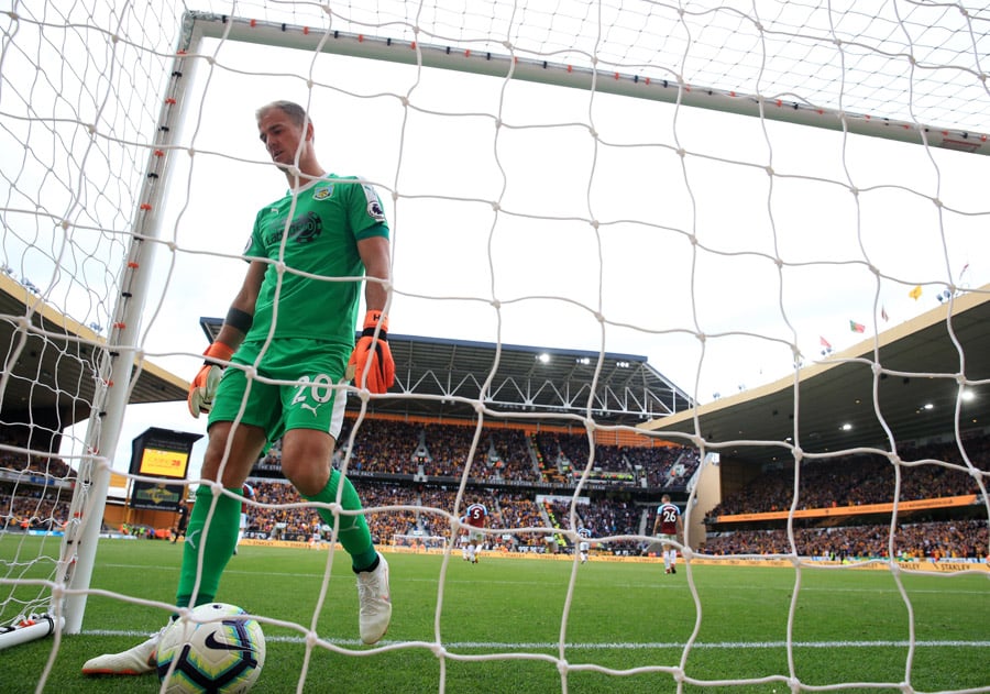 burnley goalkeeper picks the ball out of the net