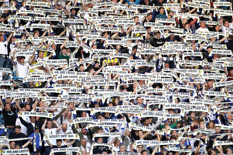 leeds united fans holding scarves