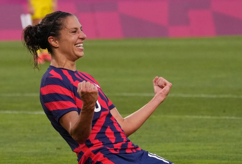 carli lloyd celebrates a goal