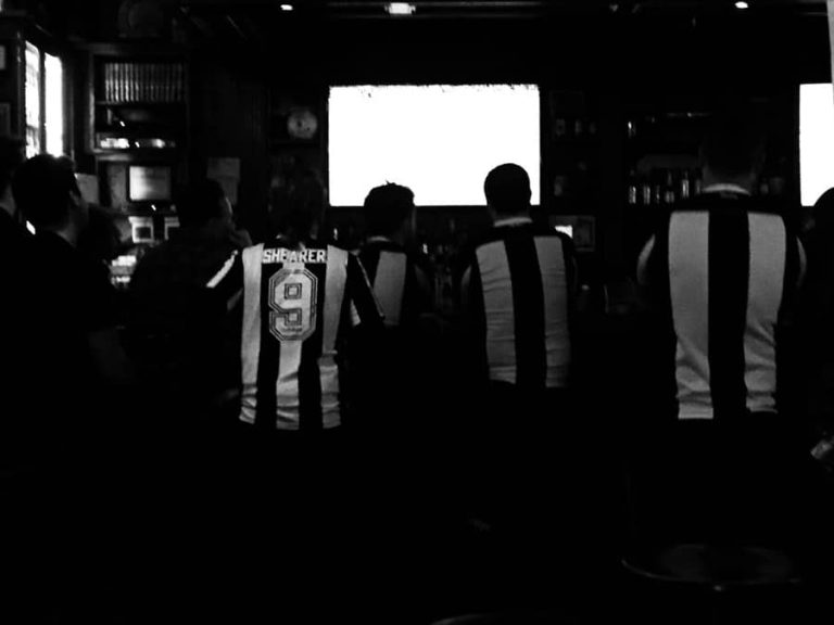 Newcastle fans watch the game at Peter Dillon's soccer pub in midtown