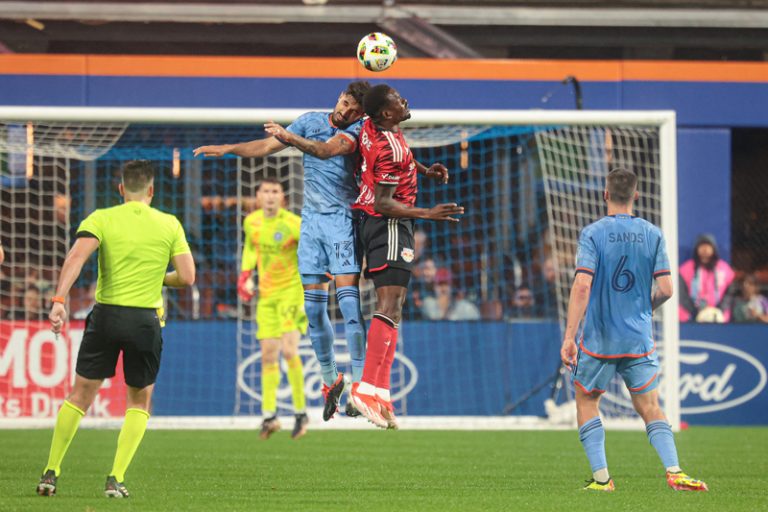 New York Red Bulls forward Cory Burke (7) fights for a high ball against New York City FC defender Thiago
