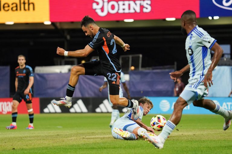 NYCFC forward Kevin O'Toole leaps over a fallen CF Montreal midfielder Bryce Duke