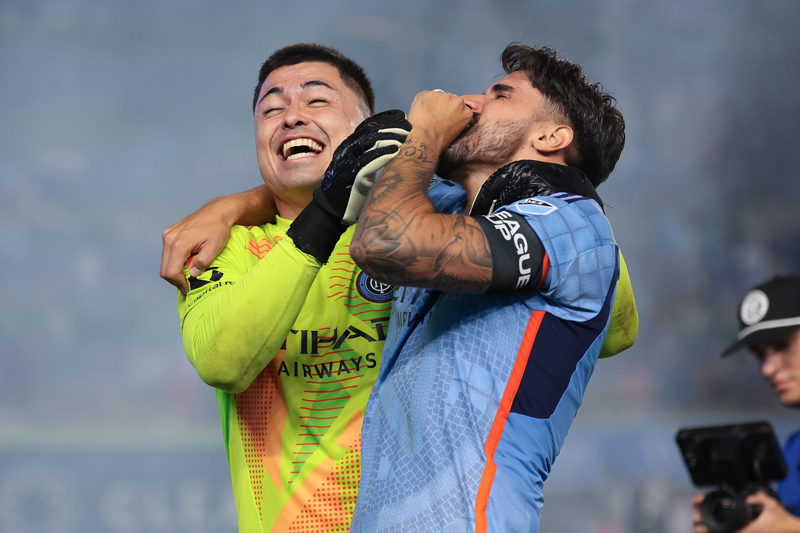 NYCFC goalkeeper Luis Barraza celebrates with defender Thiago