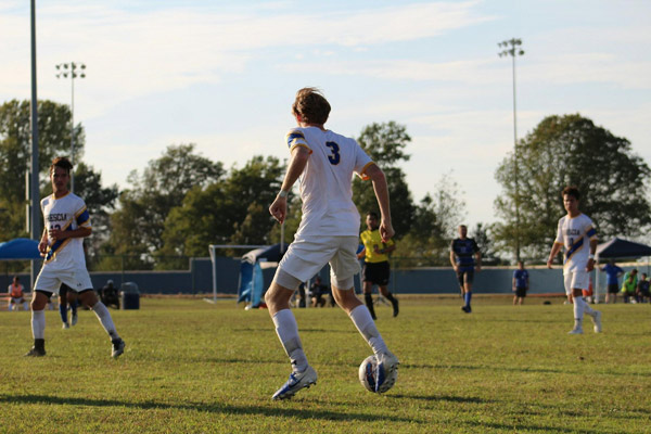 Boy playing in a youth soccer match