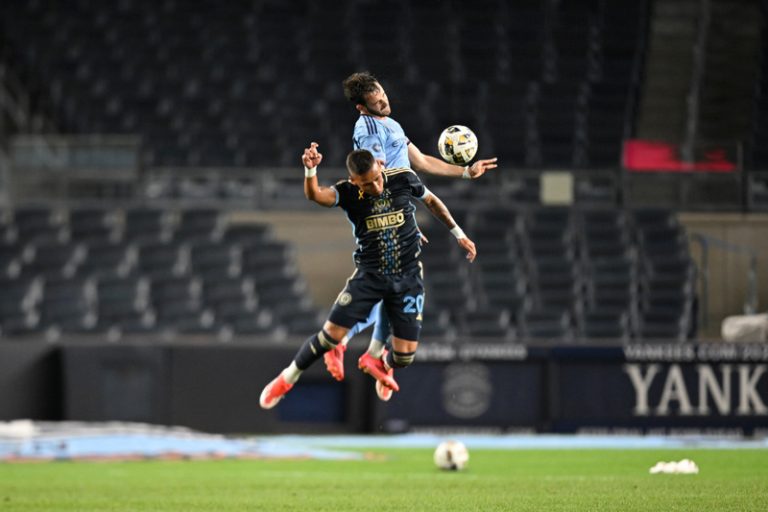 Philadelphia Union midfielder Jesus Bueno (20) battles for a header against NYCFC forward Kevin O'Toole