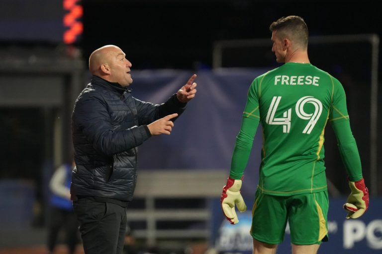 NYCFC head coach Nick Cushing talks with goalkeeper Matt Freese