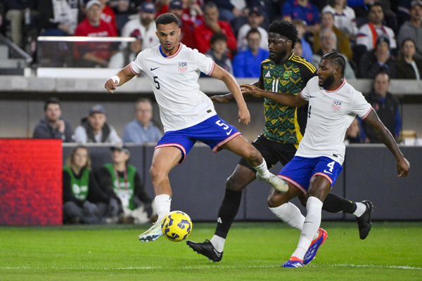 USMNT defender Antonee Robinson (5) and defender Mark McKenzie (4) defend against Jamaica forward Shamar Nicholson during the first half of the nations league game at CITYPark