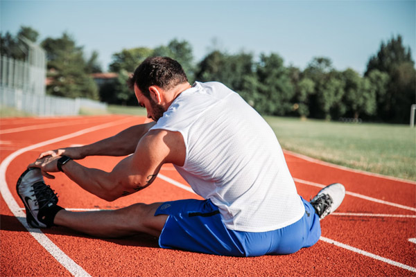 athlete warms up on the track